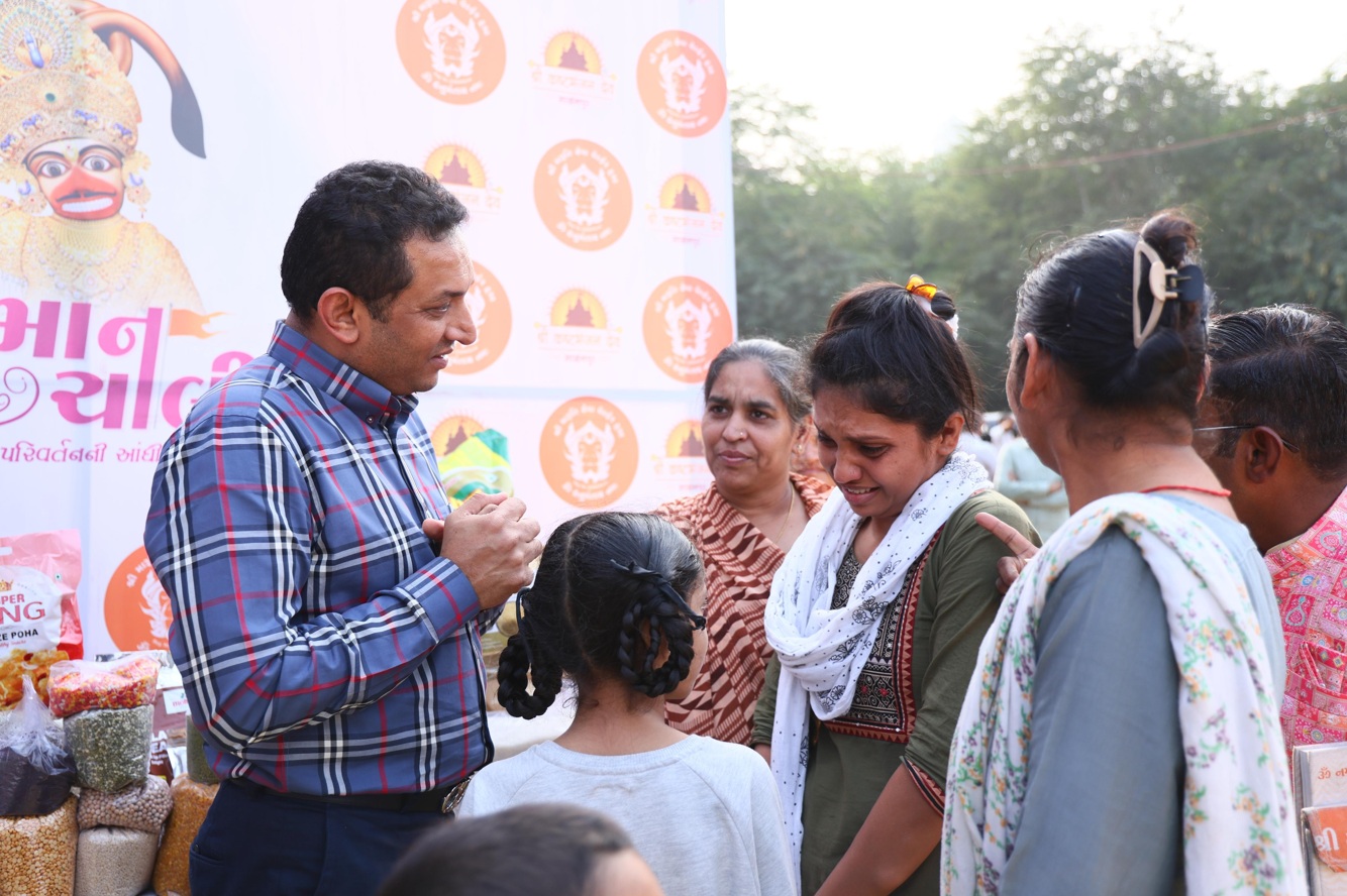 Ishver Dholakiya supporting women through annual ration kits